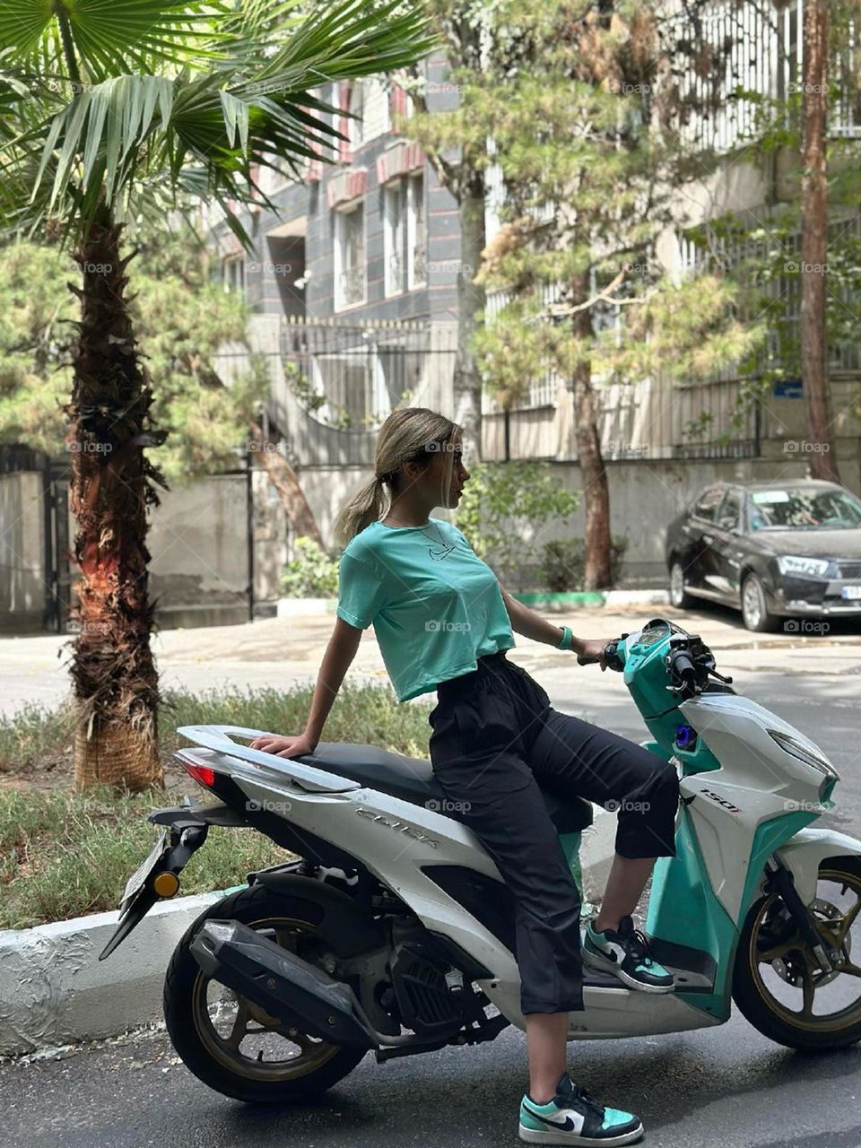 She wearing clothes, mathing to her motorcycle.. I don't know why girls look more sexy on motorcycles?