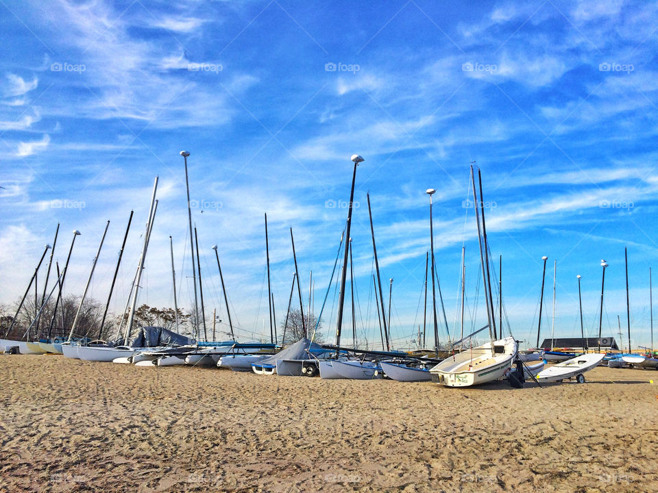 Nautical vessels on sandy beach