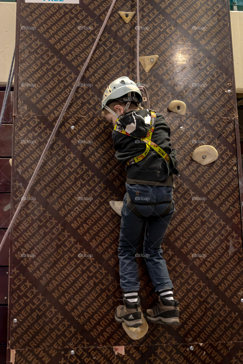 Boy climbing on the wall