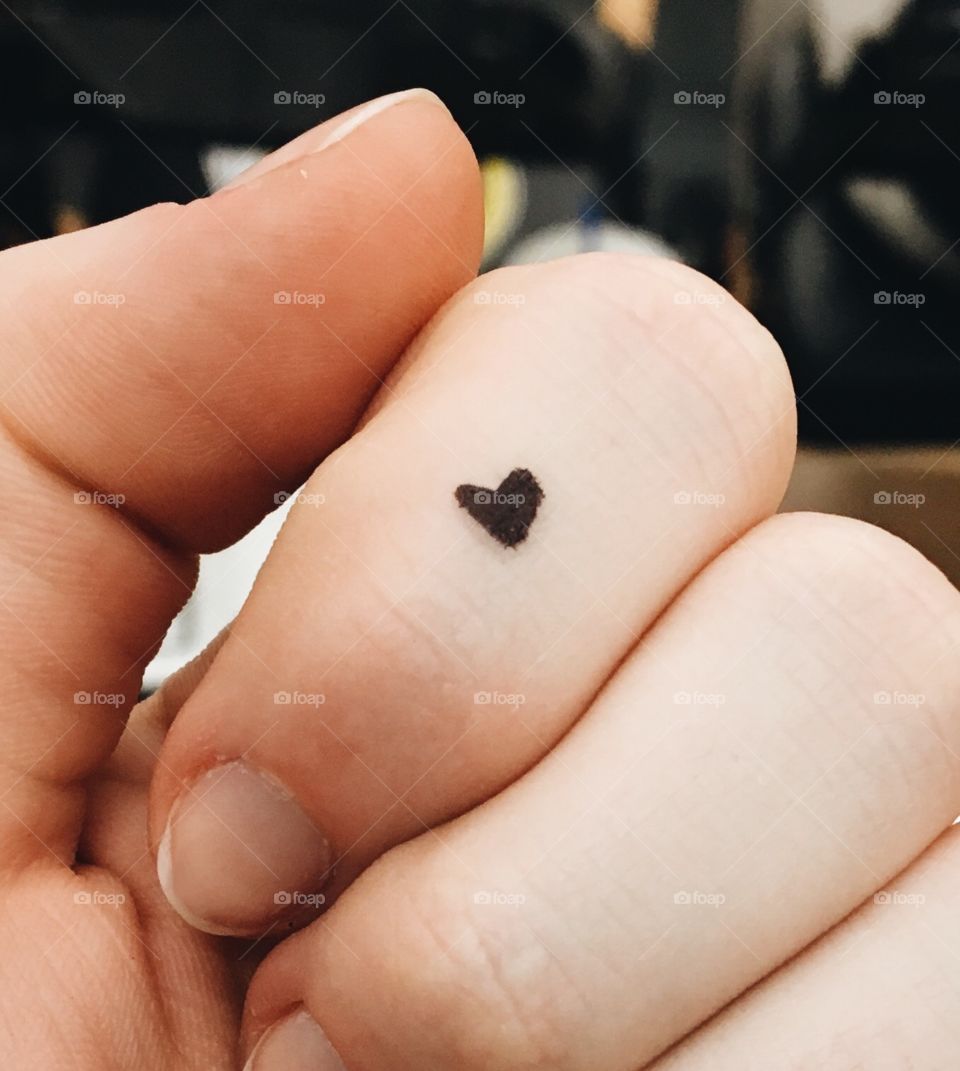 Small heart drawn on a hand. 