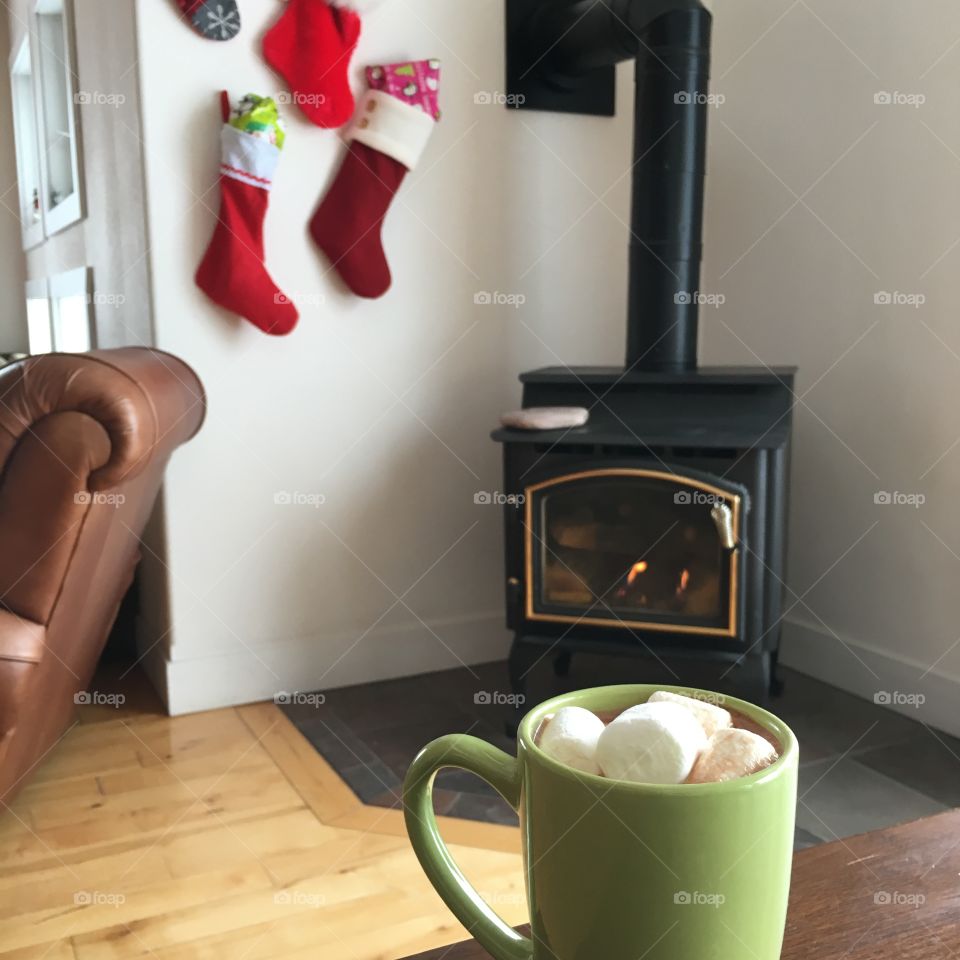 Hot cocoa by the fireplace.