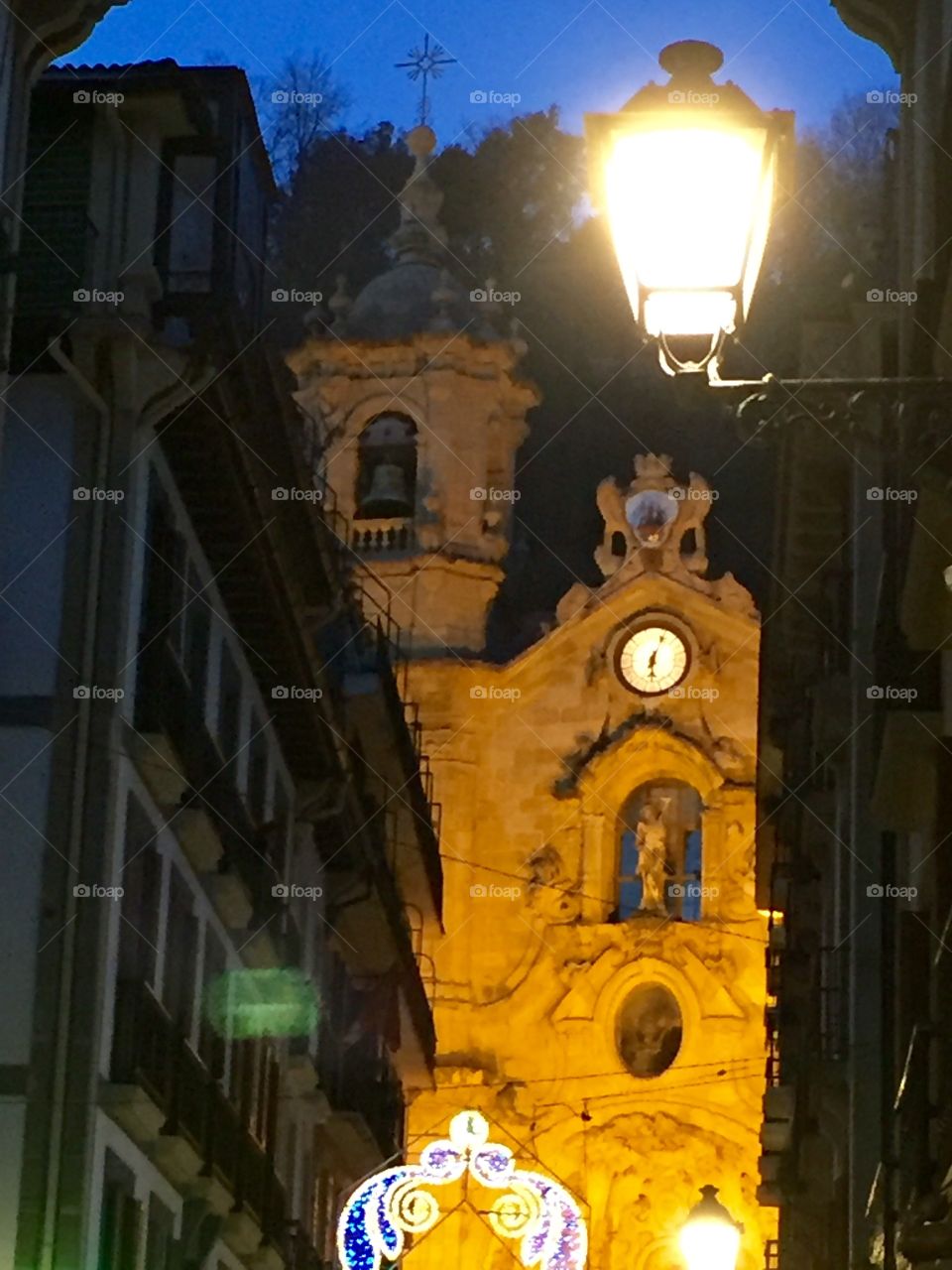 Church with clock at the end of the street