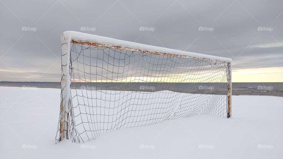 Winter season ❄️ Football goal on the seashore ⬜