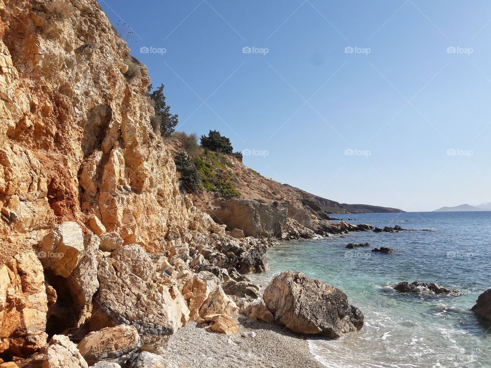 A sunny day on a wild beach on the greek island of Paros