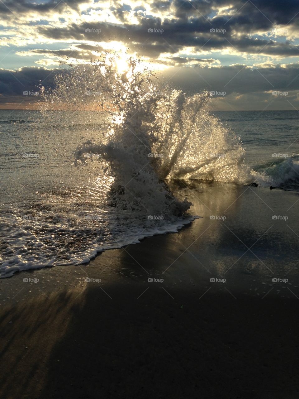 This was taken during sunrise as the waves crashed by the shore creating a magnificent image
