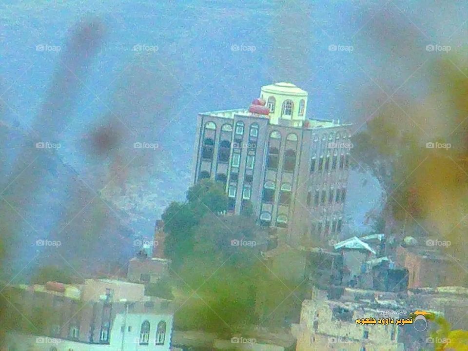 A stunning view of green mountains covered in fog in Yemen