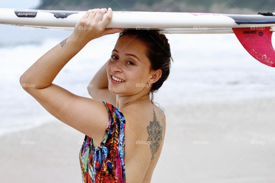 happy girl with surfboard