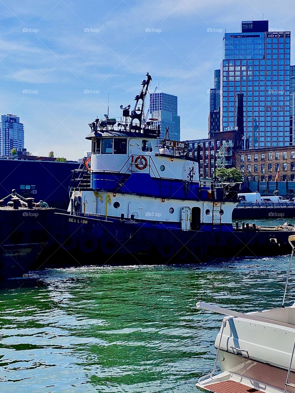 The wheelhouse of a very large industrial barge that has been approaching us for the past few minutes is now directly face to face with us here at “Newtown Creek” by the “Pulaski Bridge” in LIC, Queens. 2023. Hypnotic Productions