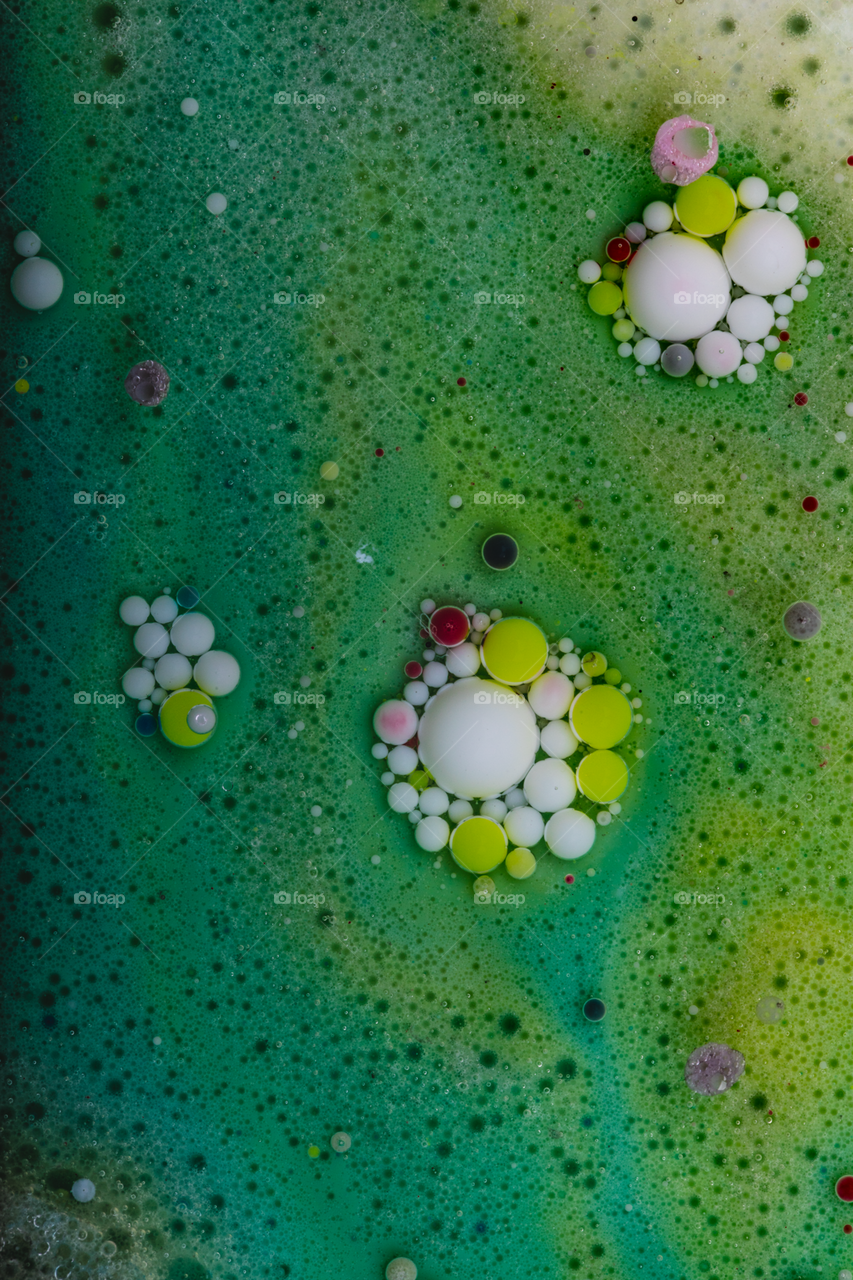 Mixed liquids like (color,oil,soap,milk) then photographing it by macro lens 100mm f2.8 lens