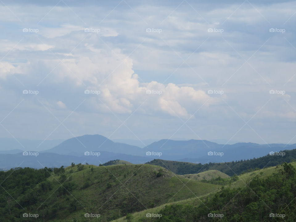 Landscape hills elevations with mountain range in distant