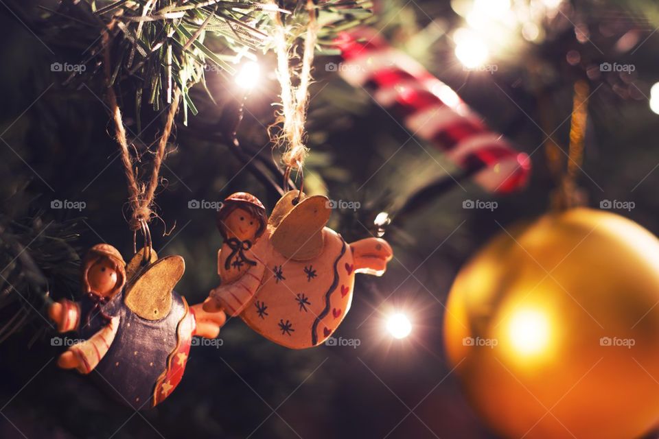 angels hanging on a christmas tree