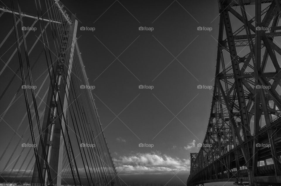 There can be only one King.... Side by side shot of the new Eastern Span of the Bay Bridge and the old span. Located in Oakland, ca. 