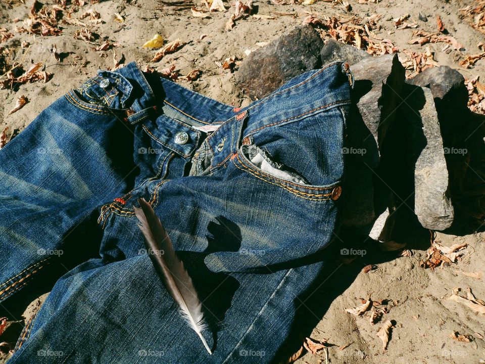 Jeans lie on the sand