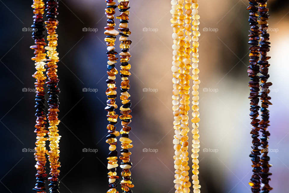 amber background of beads and necklaces at the handicraft market