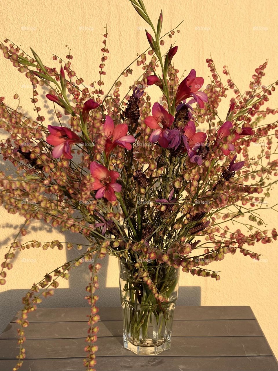 Flowers in a vase with sunset light