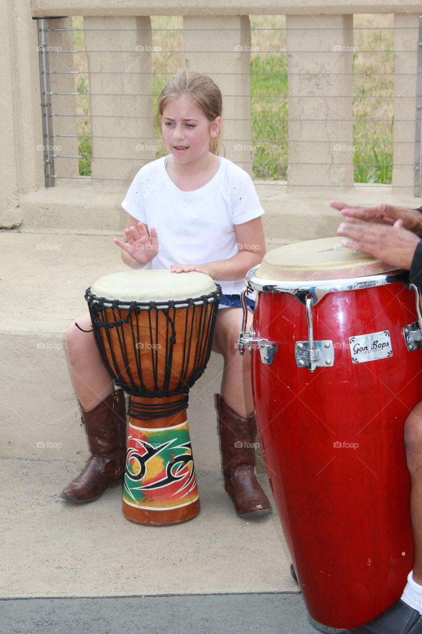 Drummer girl. Girl playing drums