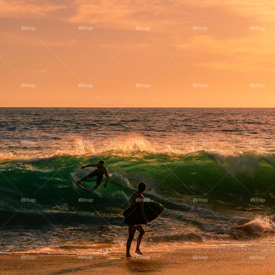 Surfing during the Sunset California