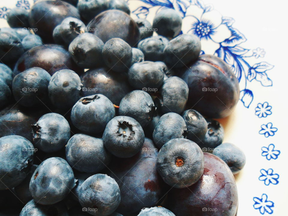 Berries of blueberries and plums