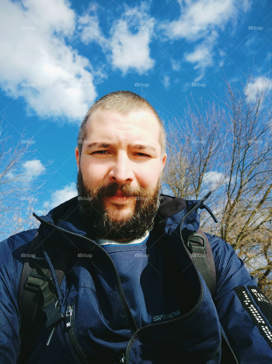 man with a beard against the sky