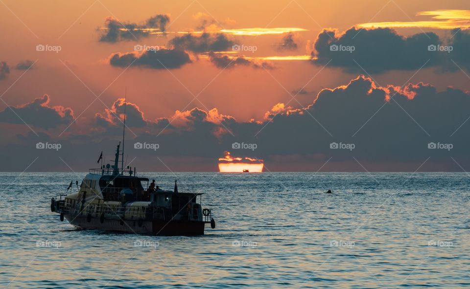 Sunset into the sea at beautiful island Koh Lipe Thailand