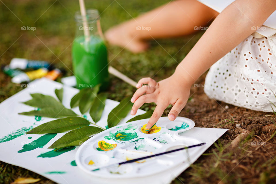 Kid painting outdoor 