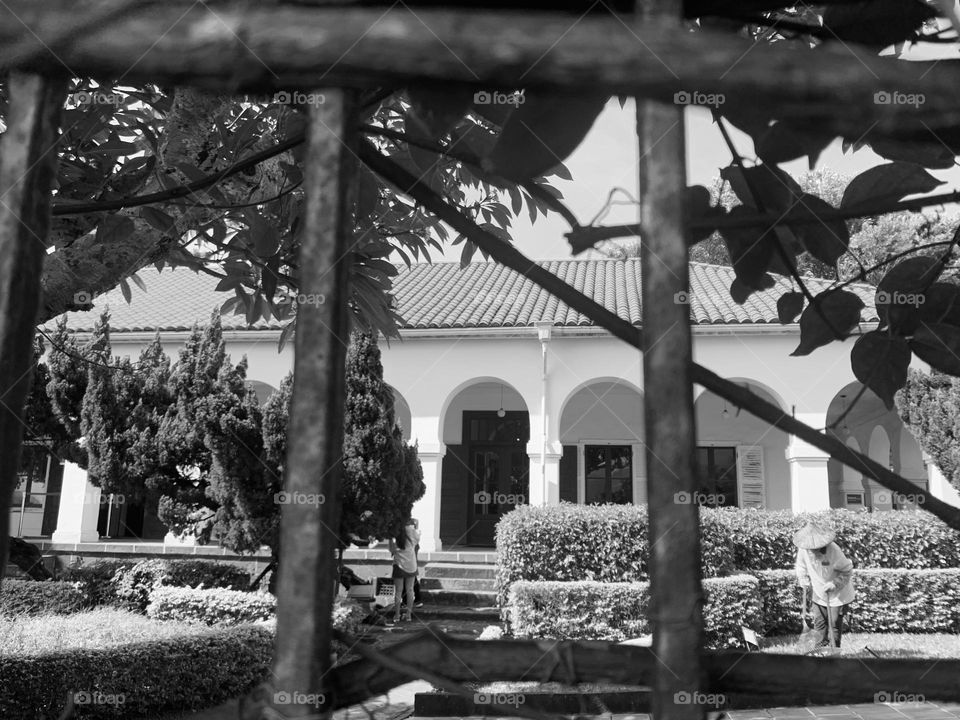 Lady doing cleanness outside the building 