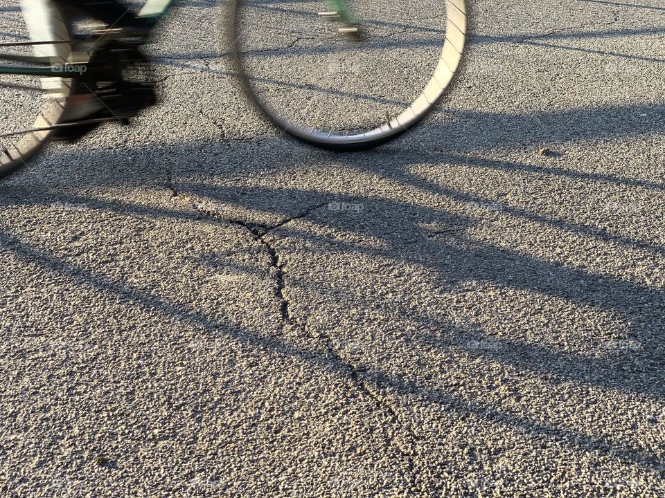 Half of the bike and it’s shadows 