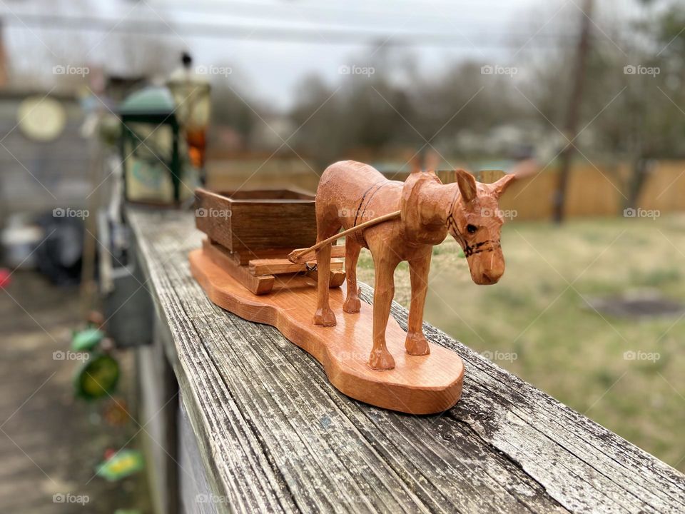 Wood carvings of tobacco wagon 