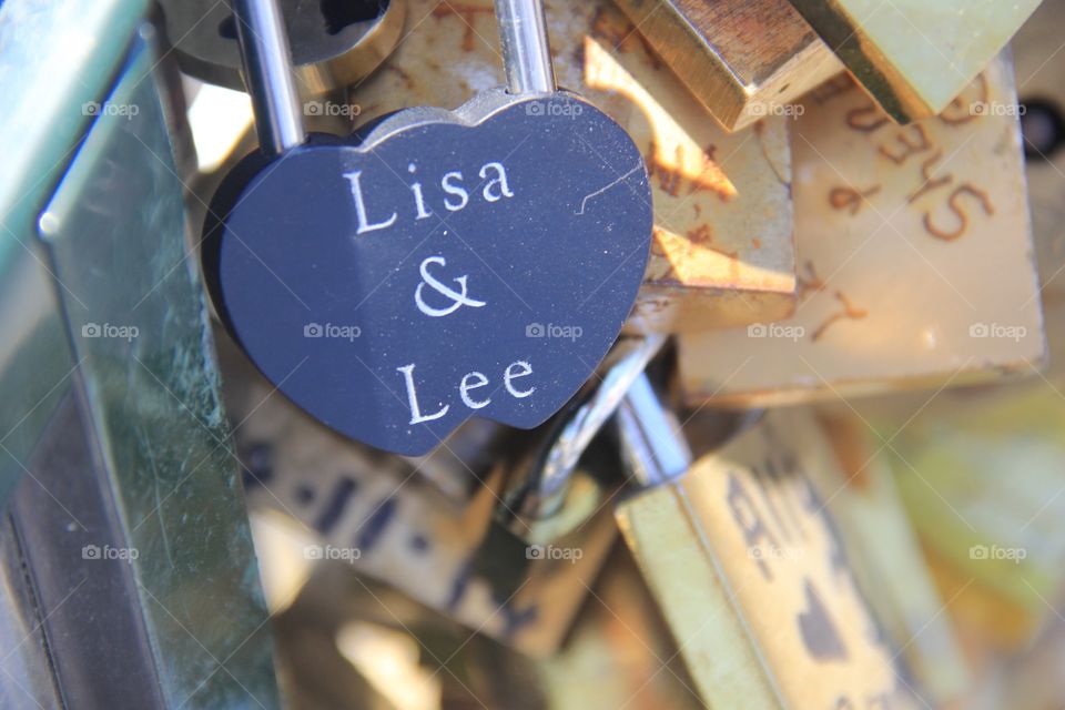 Lisa & Lee. One of the thousands upon thousands of locks cut off the bridge in Paris shortly after this photo was taken. 