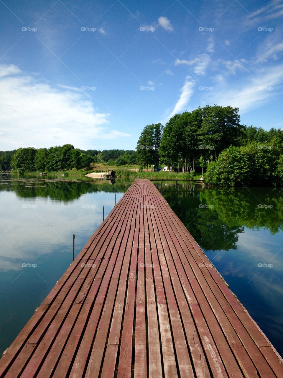 Wooden pier on the lake in polish countryside 