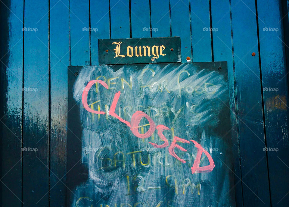 Lounge Closed sign on a door