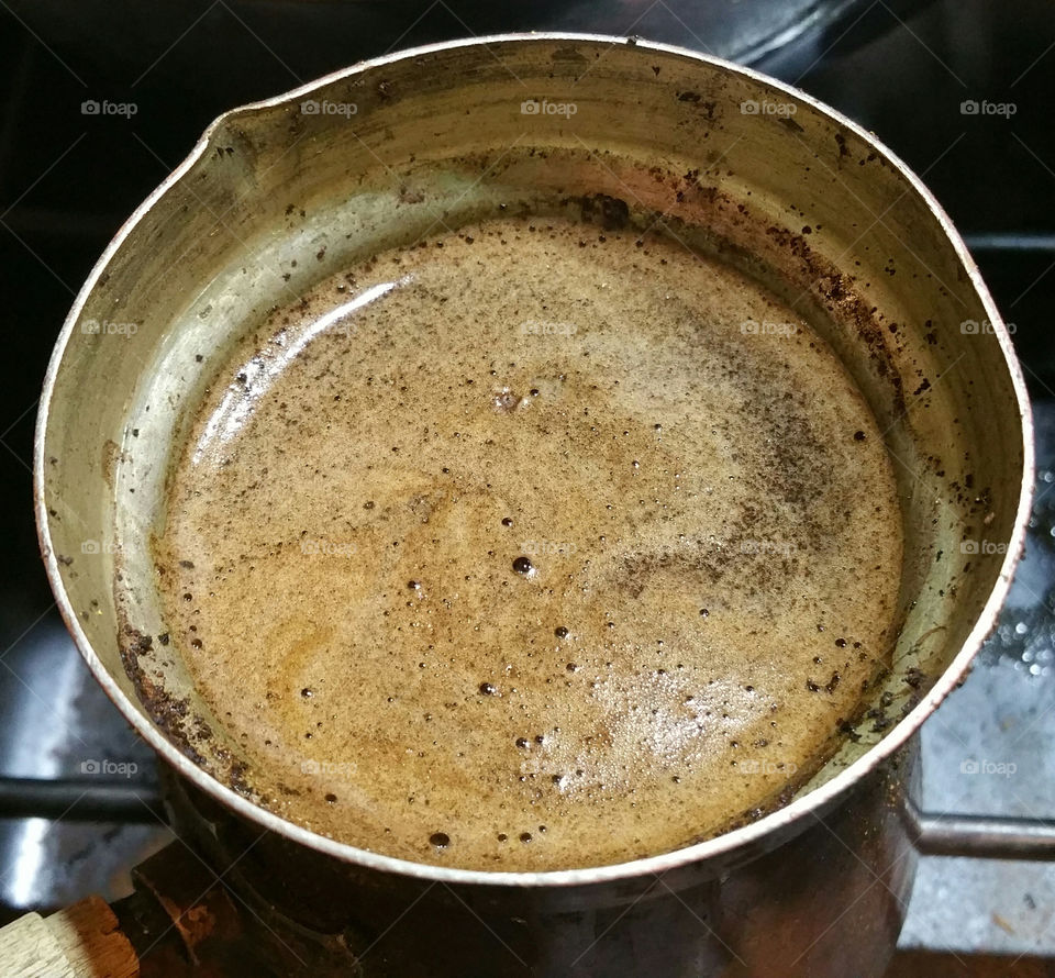 Rising coffee in a pot