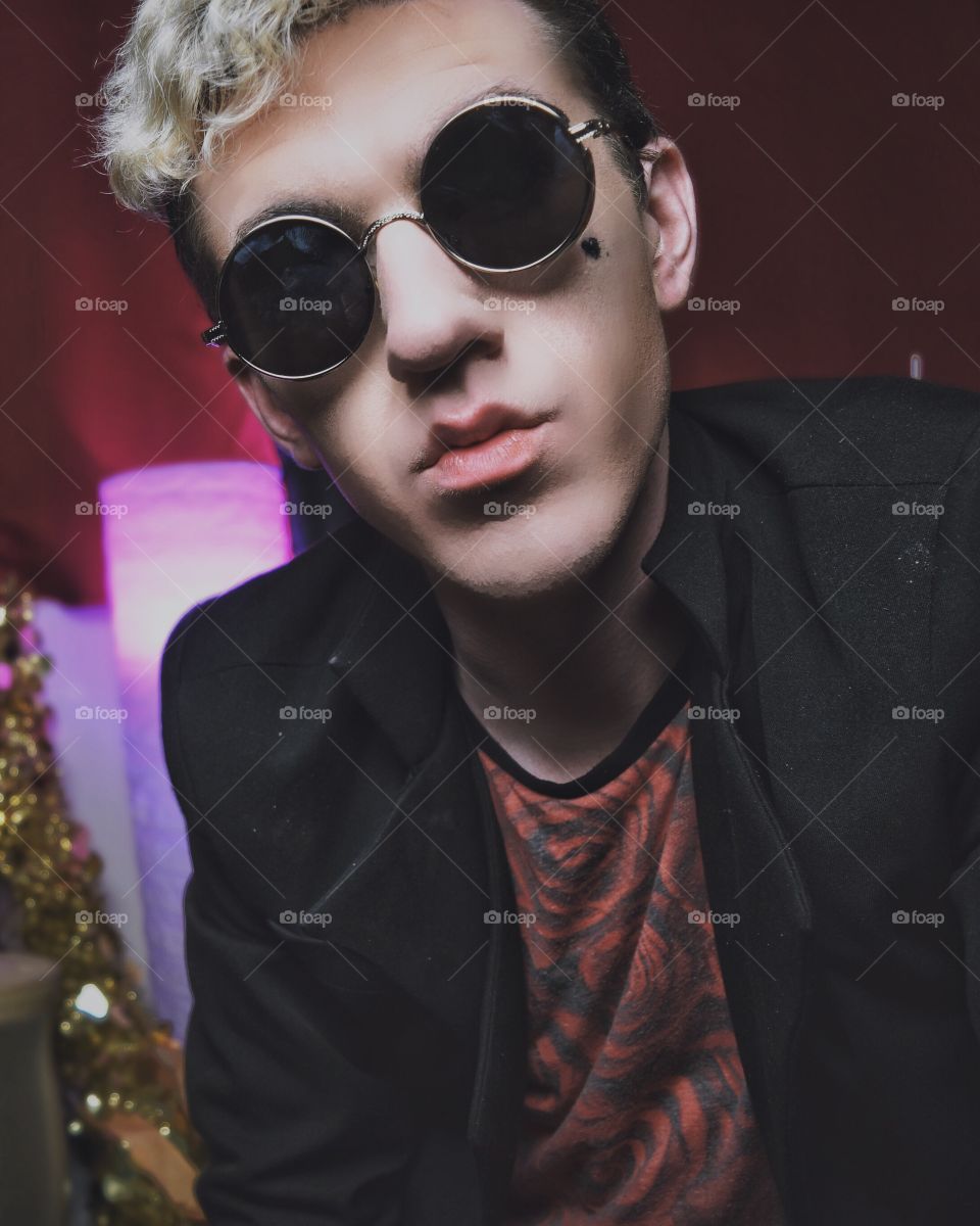 Portrait of a young handsome man in goggles