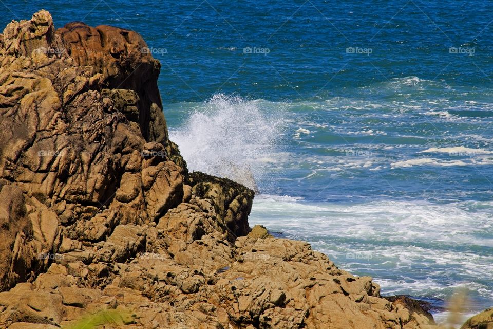 waves crashing on rocks