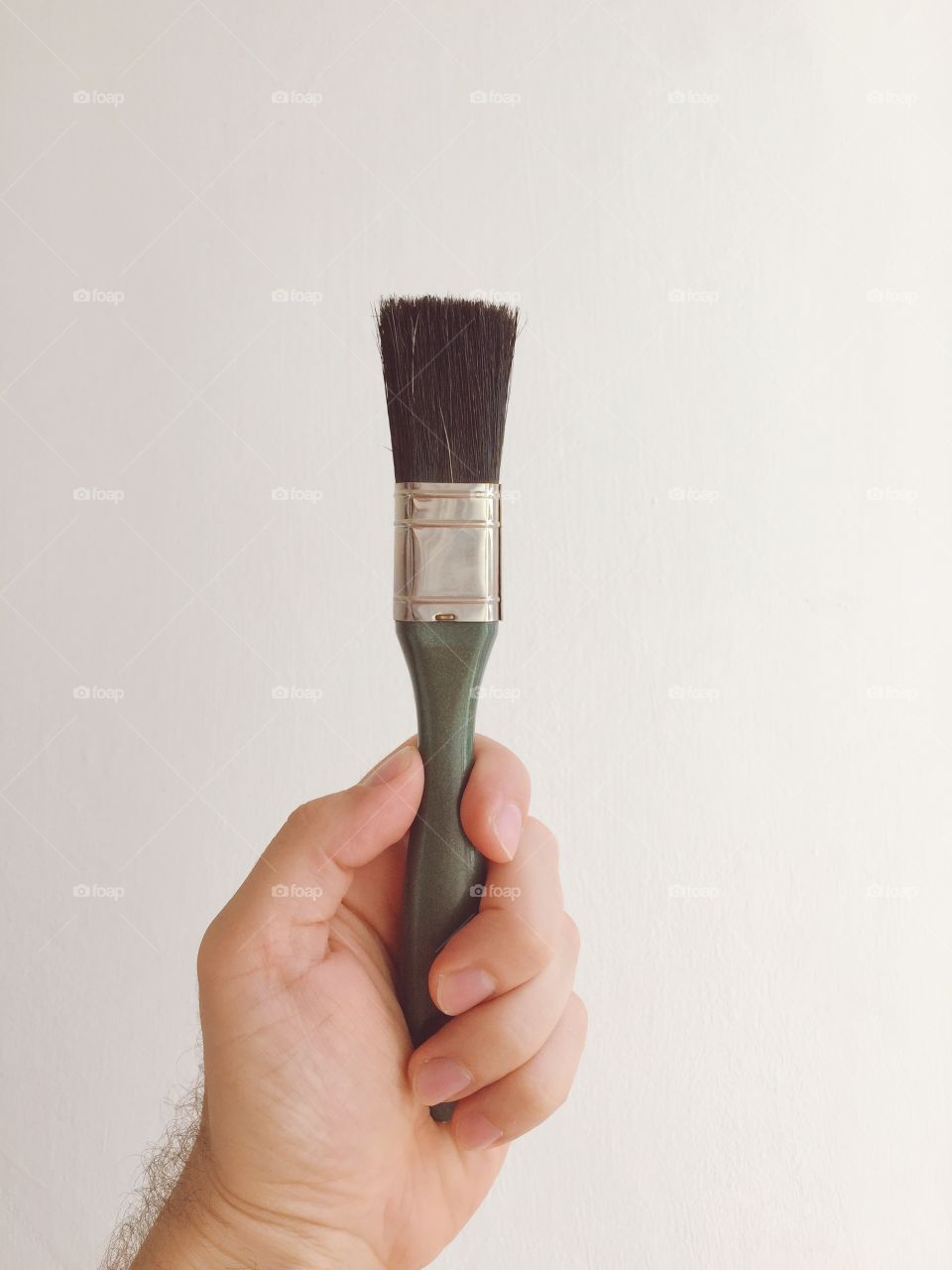 Hand with Paint brush on a white background
