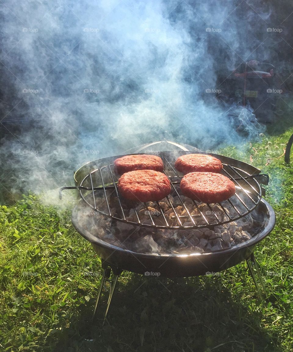 Barbecued hamburgers on grill