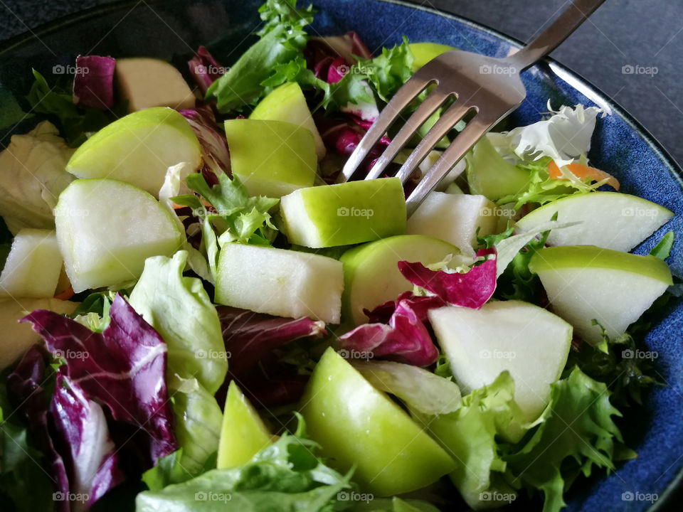 Apple and vegetable salad. Iceberg with apple salad.