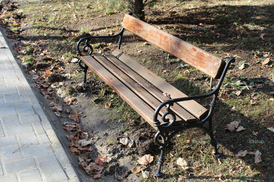 empty bench with metal ornaments