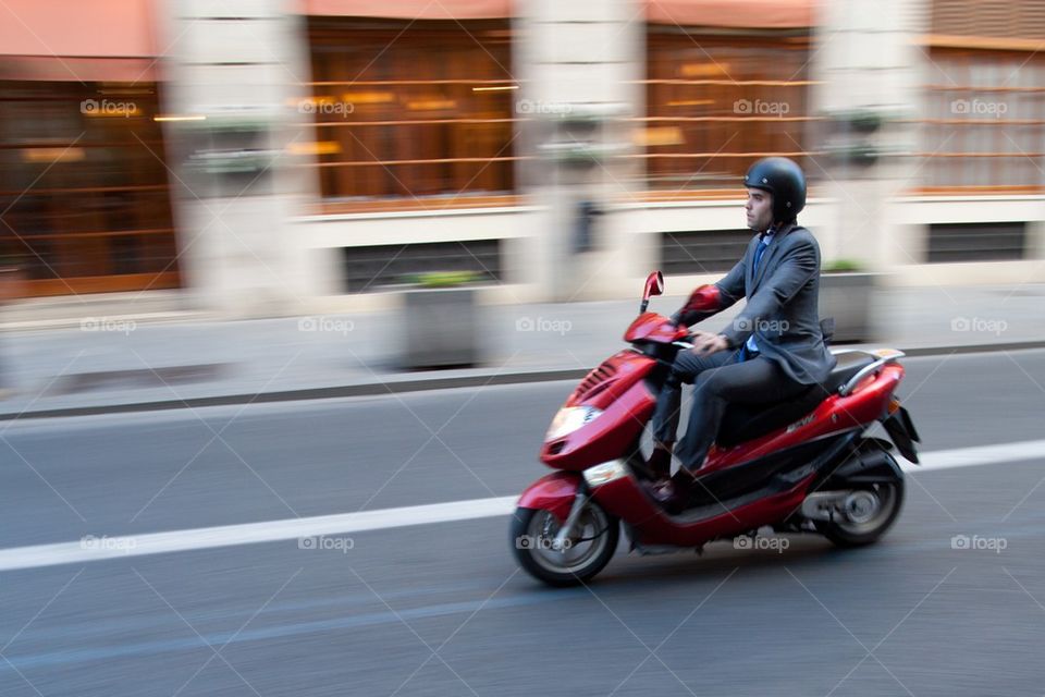 Business man on scooter.