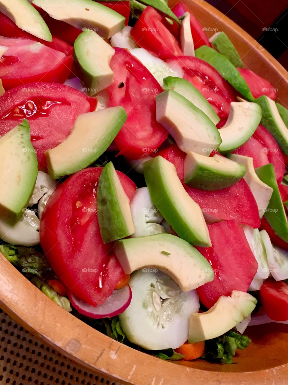 Salad in wooden bowl