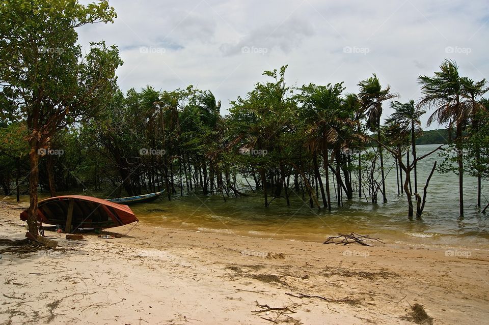 An upturned boat on a river bed 