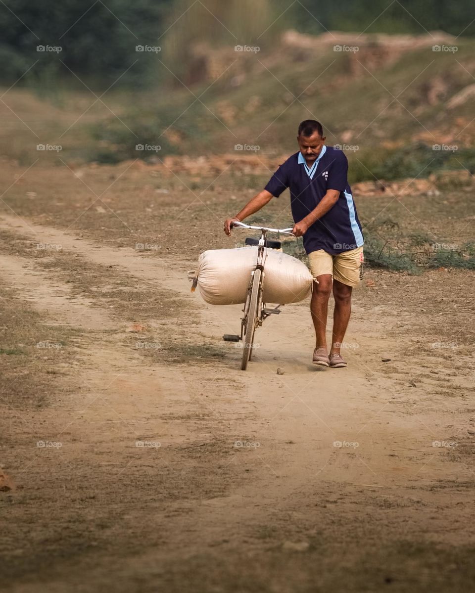 Father bringing grains for his family