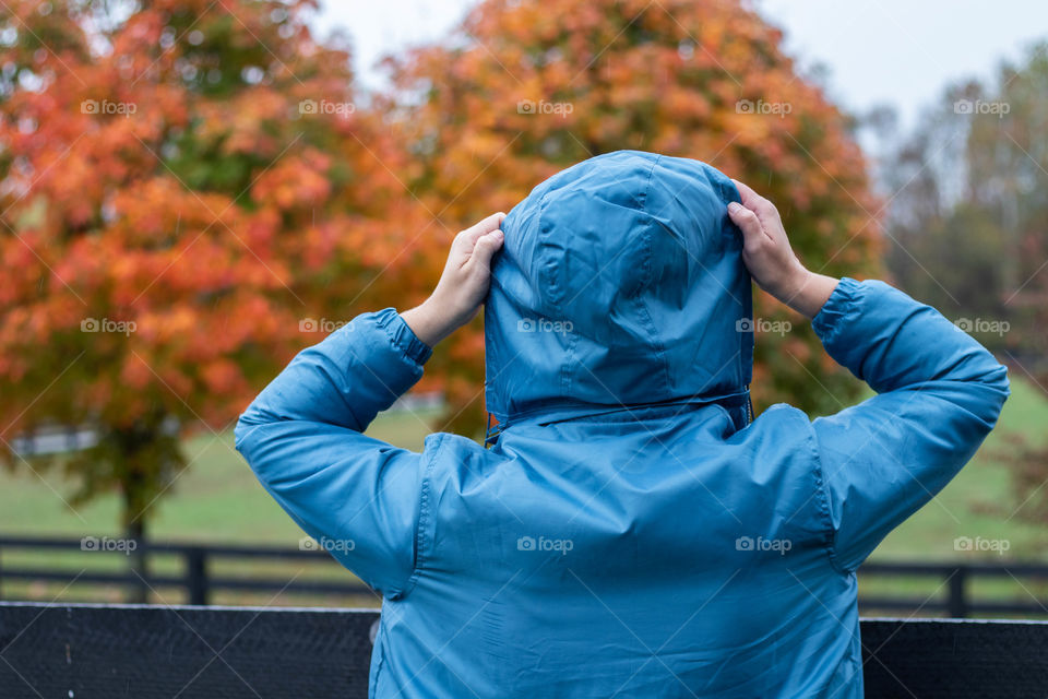 A woman on a rainy fall day