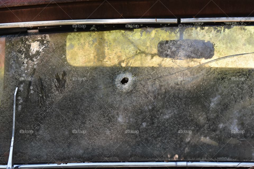 Windshield with a bullet hole