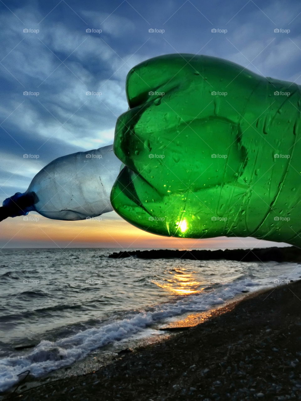 two plastic bottle and sunset