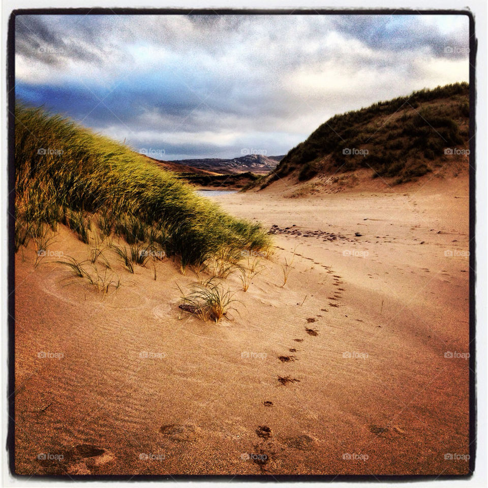 beach footprints dunes sandwood bay by robgrangephoto