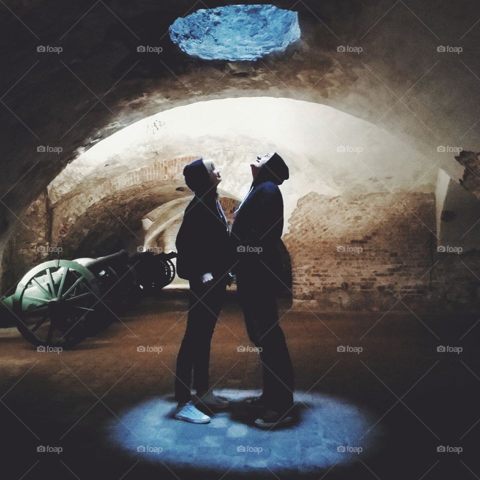 Couple standing together in tunnel