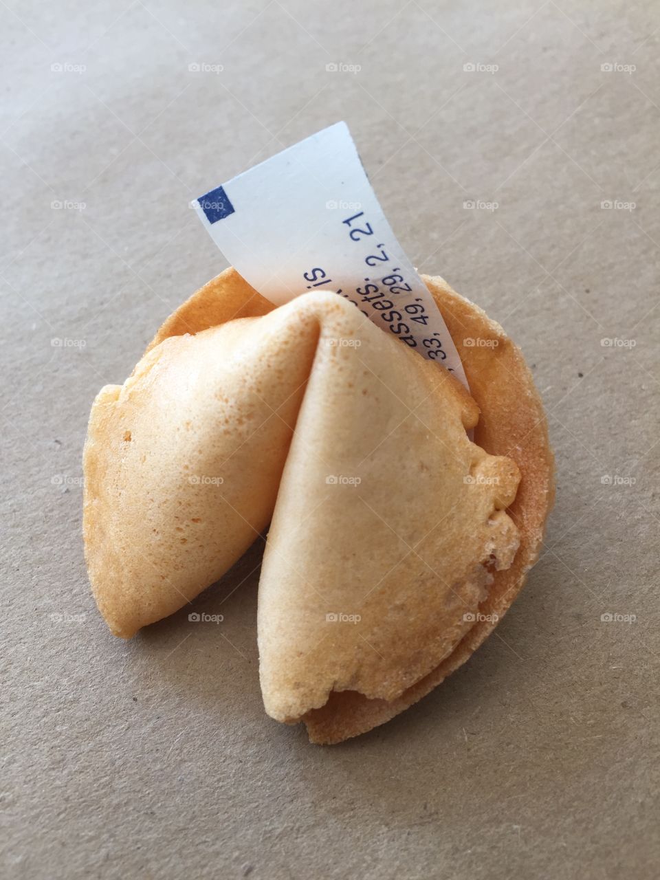 Fortune cookie. Fortune cookie with message sticking out