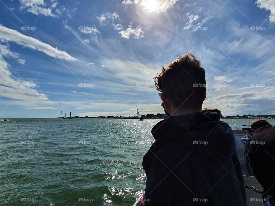 boy looking out to sea
