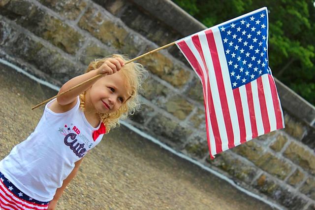 Girl holding American flag